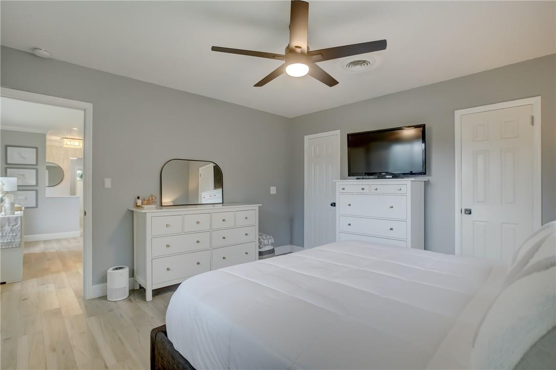 4117 McKinley Street Hollywood, FL 33021 - Photo 30 of 52 a bedroom with a bed and a flat screen tv