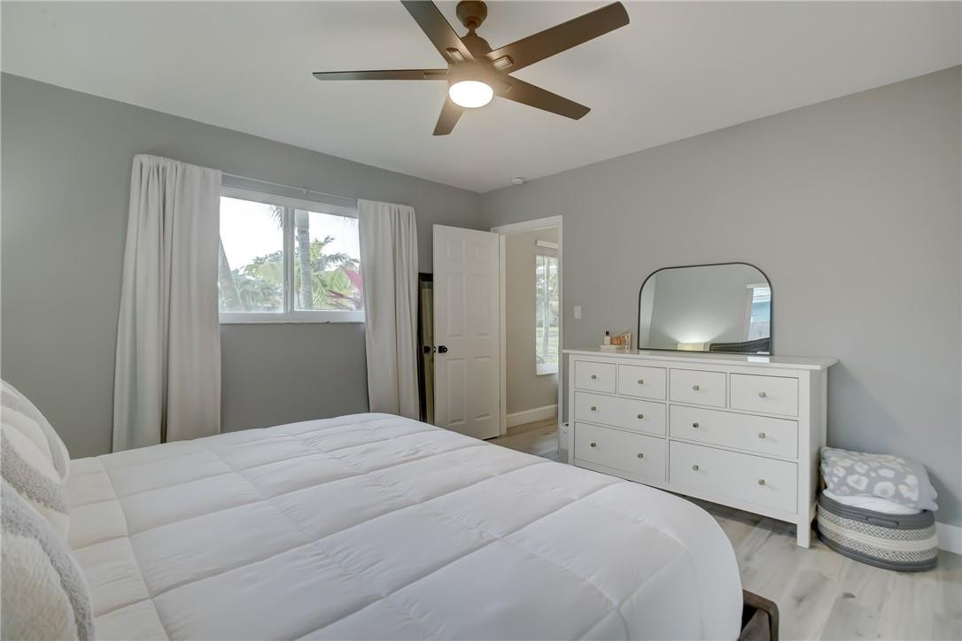 4117 McKinley Street Hollywood, FL 33021 - Photo 32 of 52 a bedroom with a bed and a dresser
