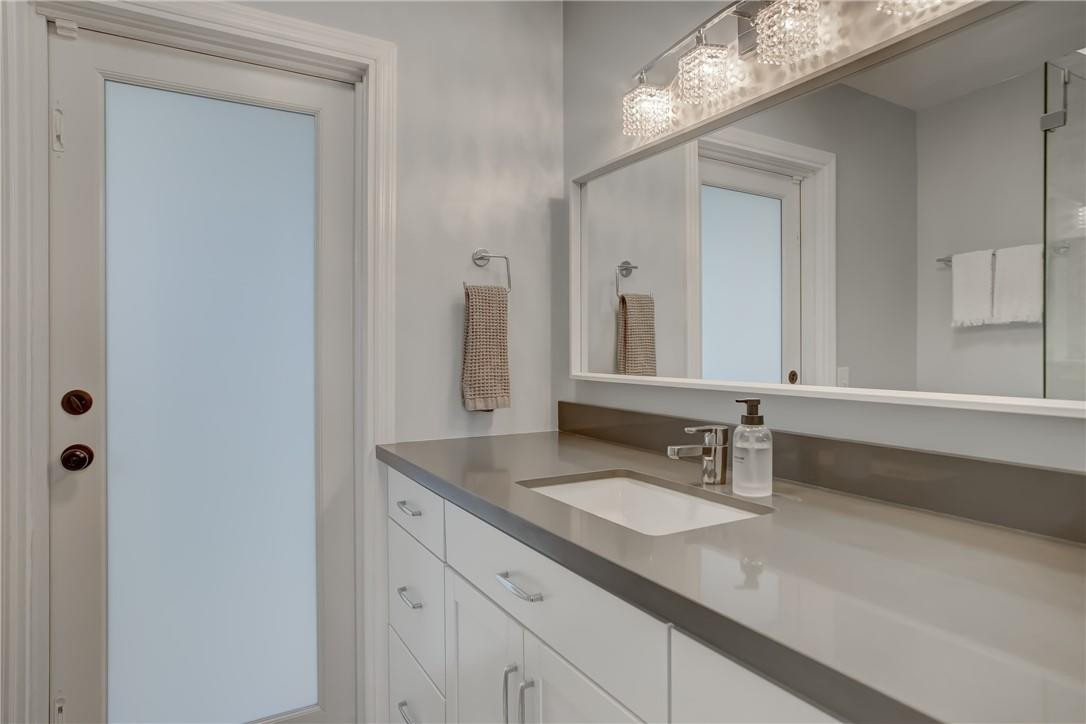 4117 McKinley Street Hollywood, FL 33021 - Photo 33 of 52 a bathroom with a sink and a mirror