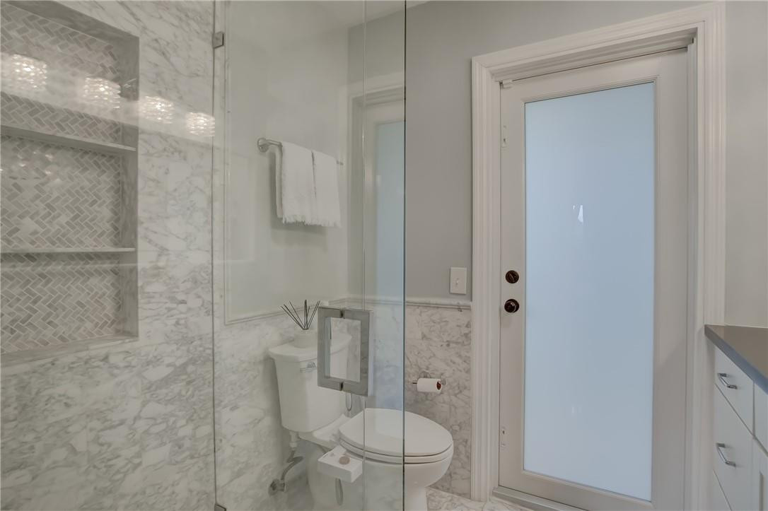 4117 McKinley Street Hollywood, FL 33021 - Photo 34 of 52 a bathroom with a toilet and a shower