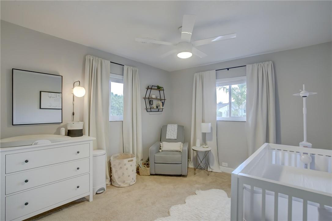 4117 McKinley Street Hollywood, FL 33021 - Photo 36 of 52 a bedroom with furniture and a window