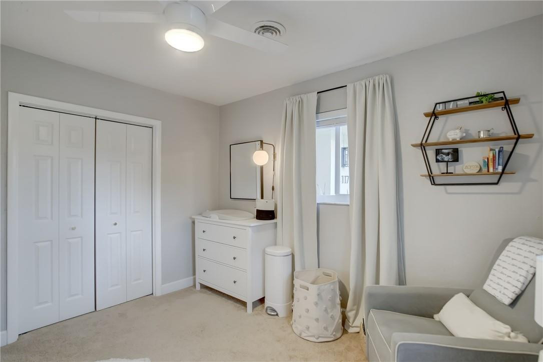 4117 McKinley Street Hollywood, FL 33021 - Photo 37 of 52 a spacious bedroom with a bed and a couch