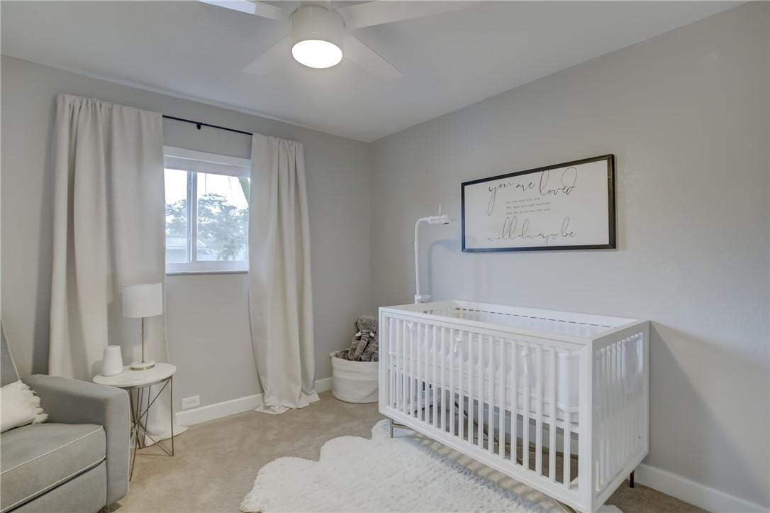 4117 McKinley Street Hollywood, FL 33021 - Photo 38 of 52 a bedroom with a bed and a window