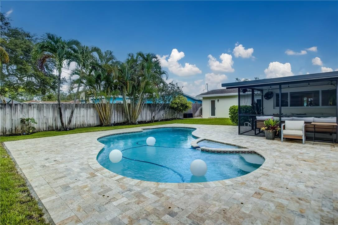 4117 McKinley Street Hollywood, FL 33021 - Photo 49 of 52 a view of a swimming pool with a patio