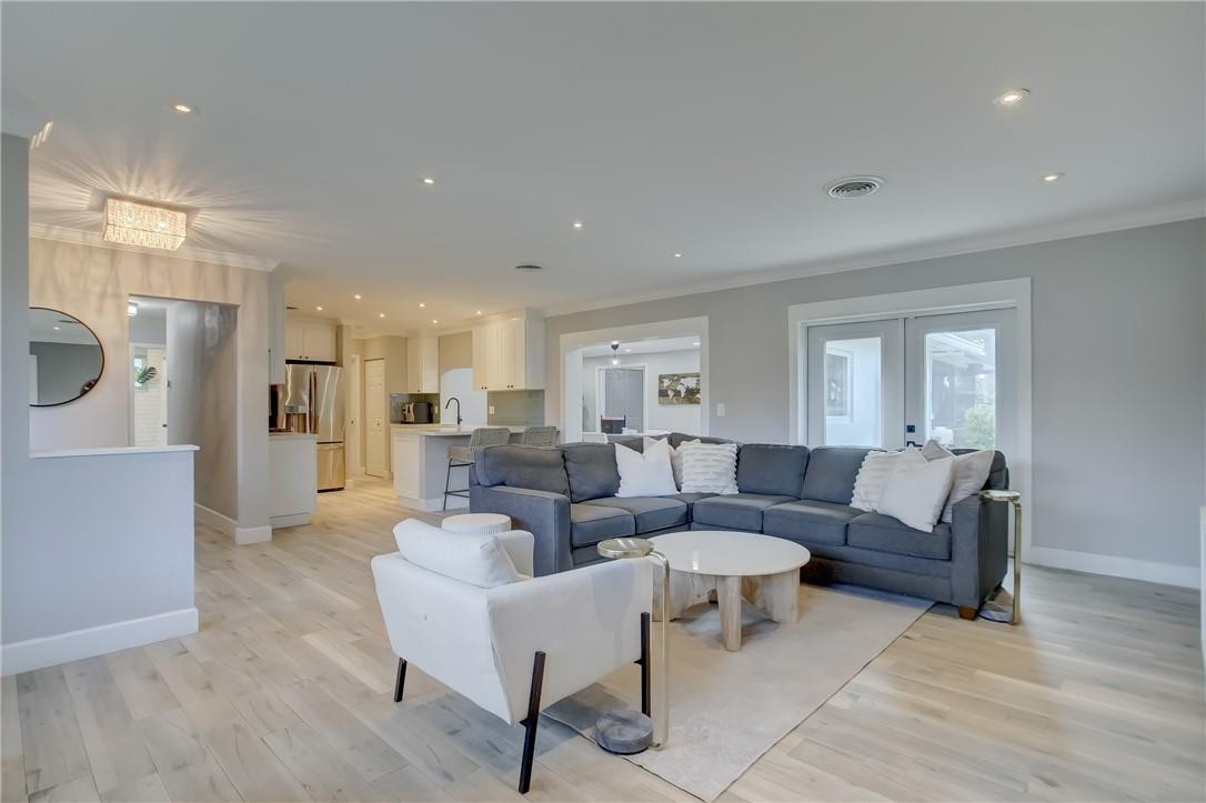 4117 McKinley Street Hollywood, FL 33021 - Photo 6 of 52 a living room with furniture and a wooden floor