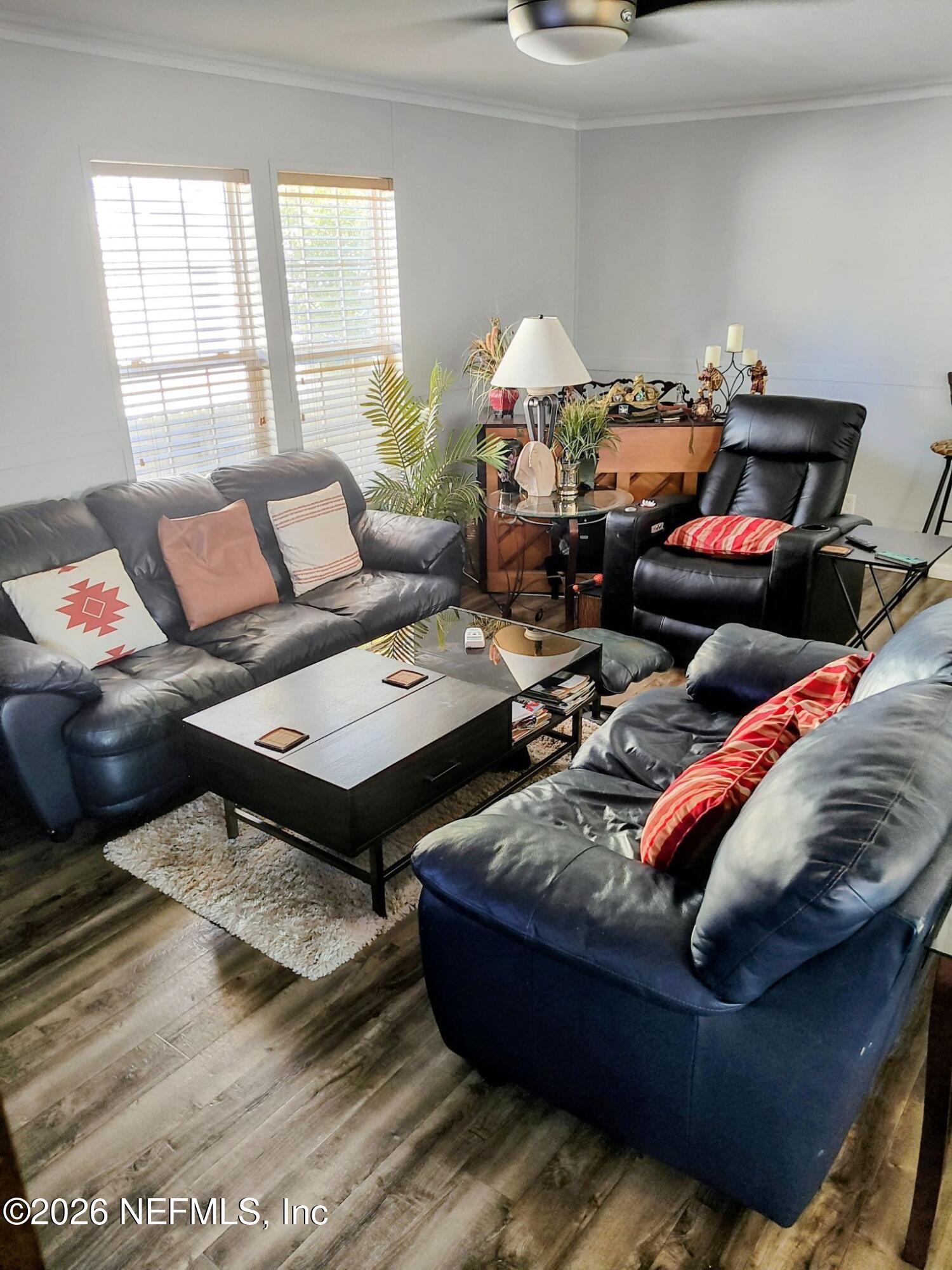 137 Lewis Street Edgewater, FL 32141 - Photo 11 of 42 a living room with furniture and a window