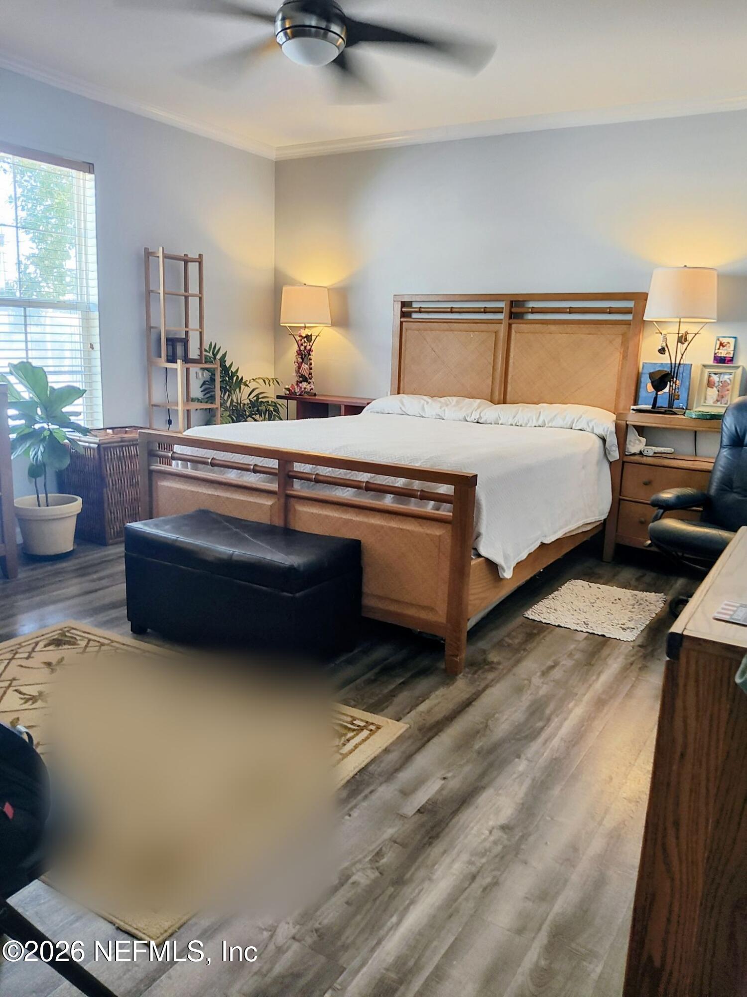137 Lewis Street Edgewater, FL 32141 - Photo 15 of 42 a bedroom with a bed and window