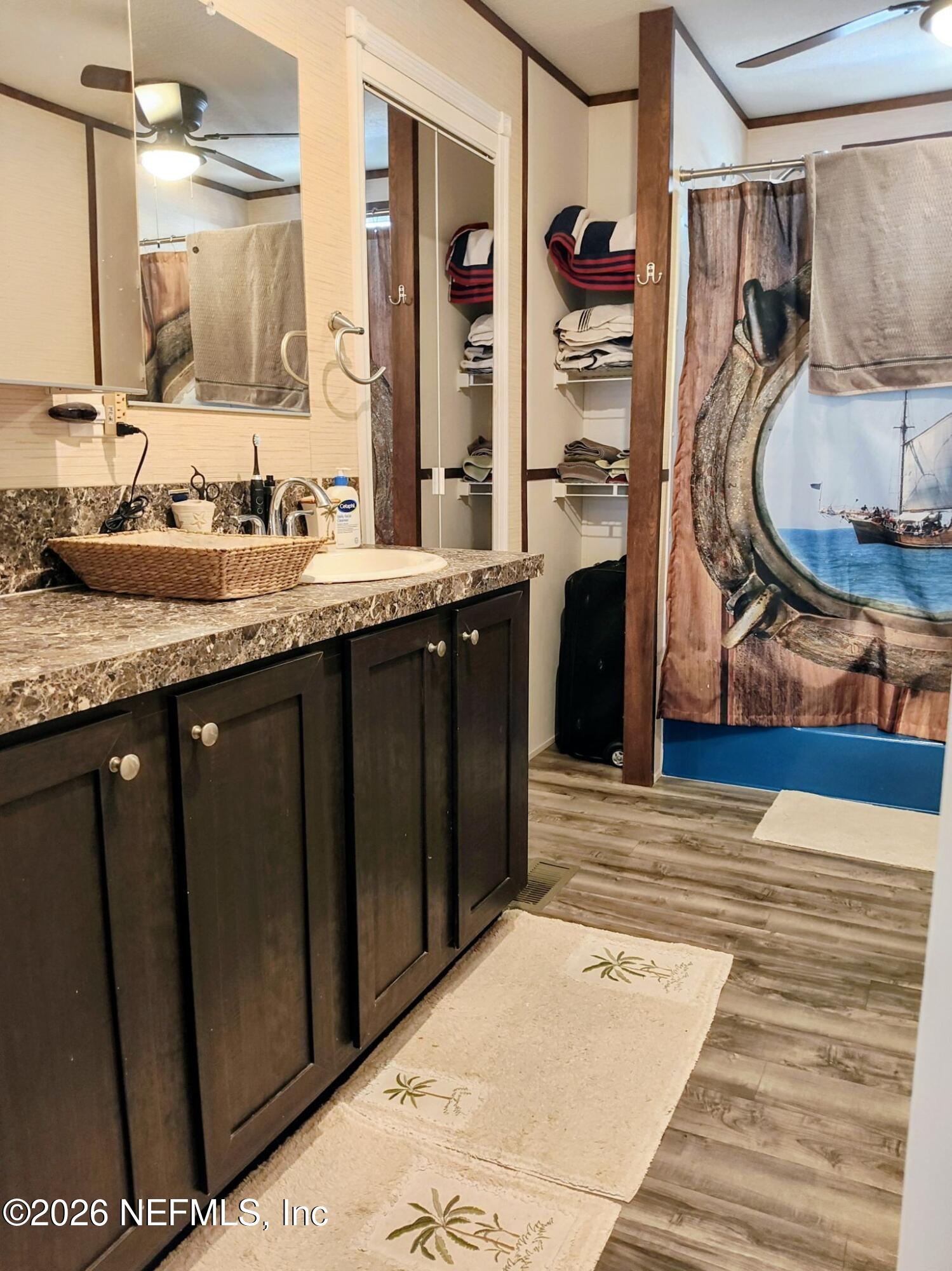 137 Lewis Street Edgewater, FL 32141 - Photo 20 of 42 a bathroom with a sink and a mirror