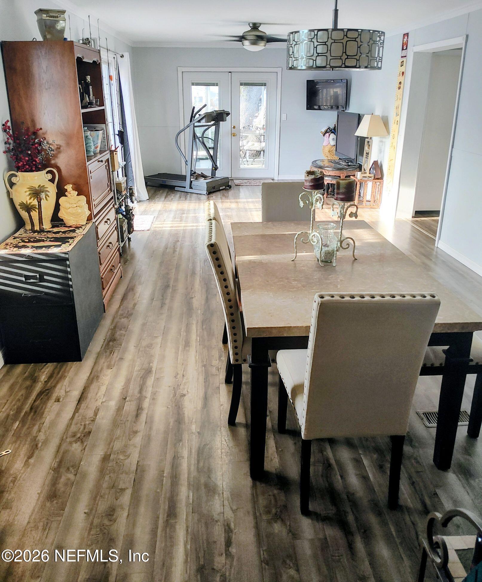 137 Lewis Street Edgewater, FL 32141 - Photo 27 of 42 a dining room with furniture and wooden floor
