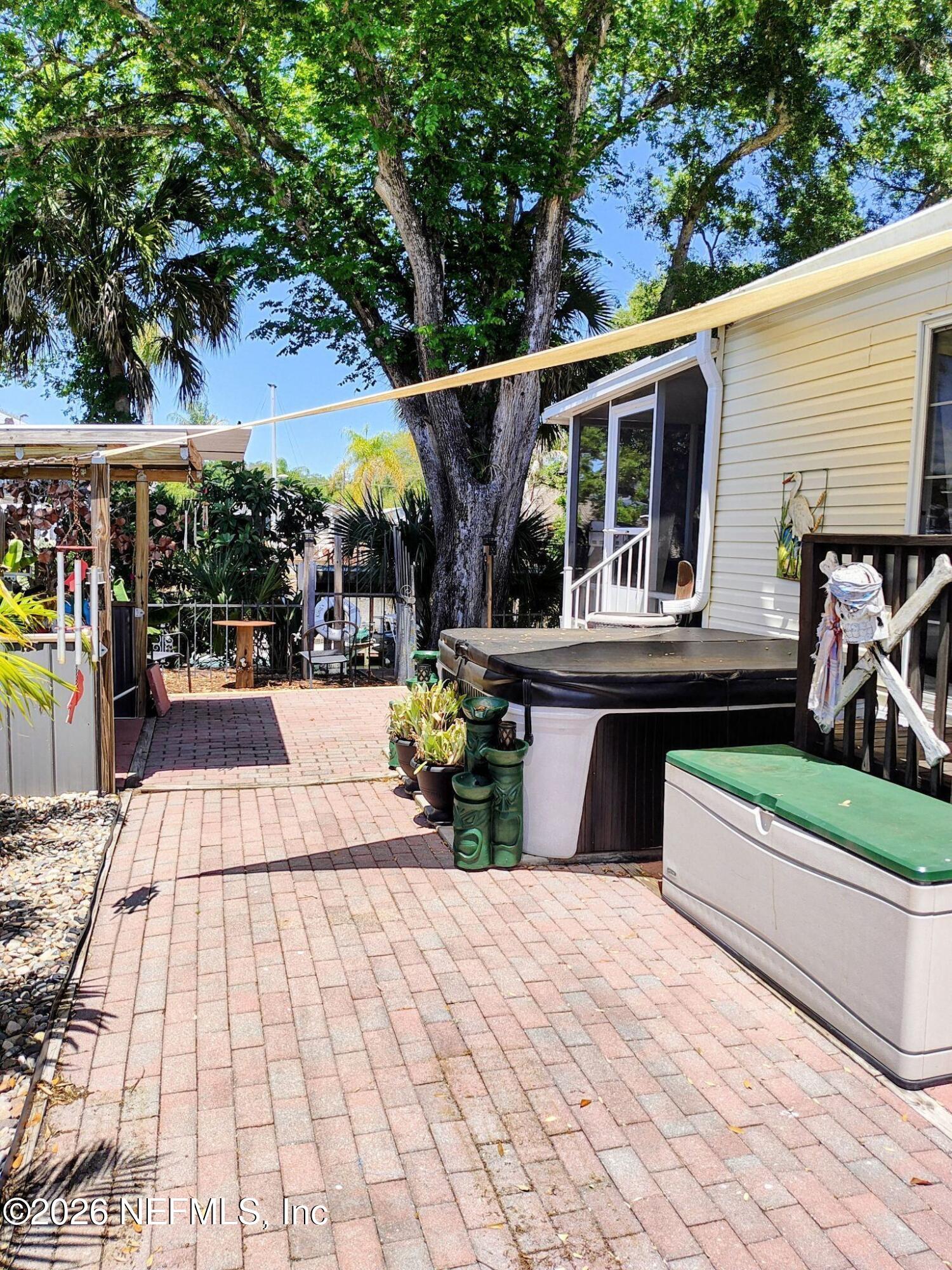 137 Lewis Street Edgewater, FL 32141 - Photo 29 of 42 a view of a chairs and tables in the patio