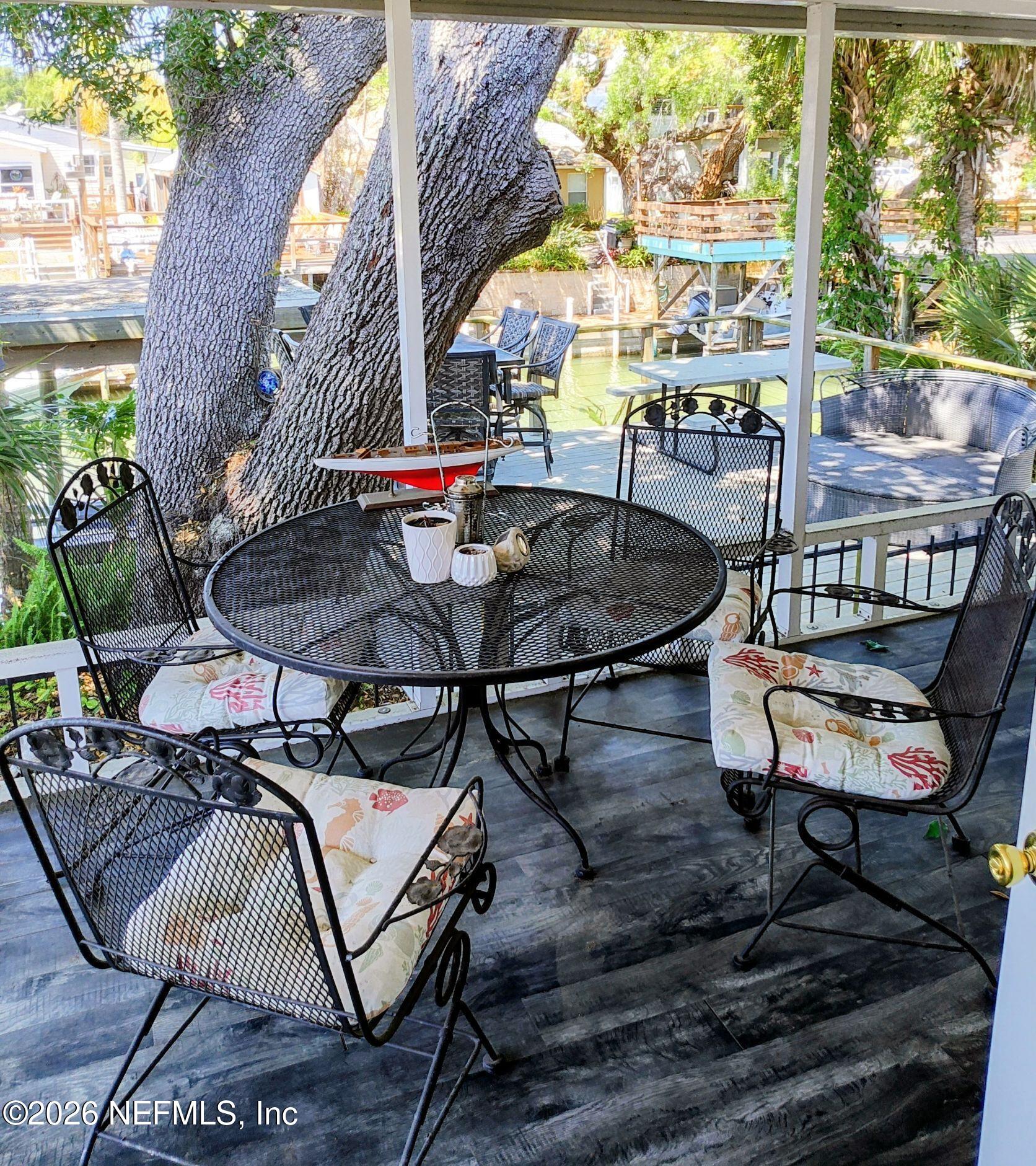 137 Lewis Street Edgewater, FL 32141 - Photo 34 of 42 an outdoor sitting area with furniture and wooden floor
