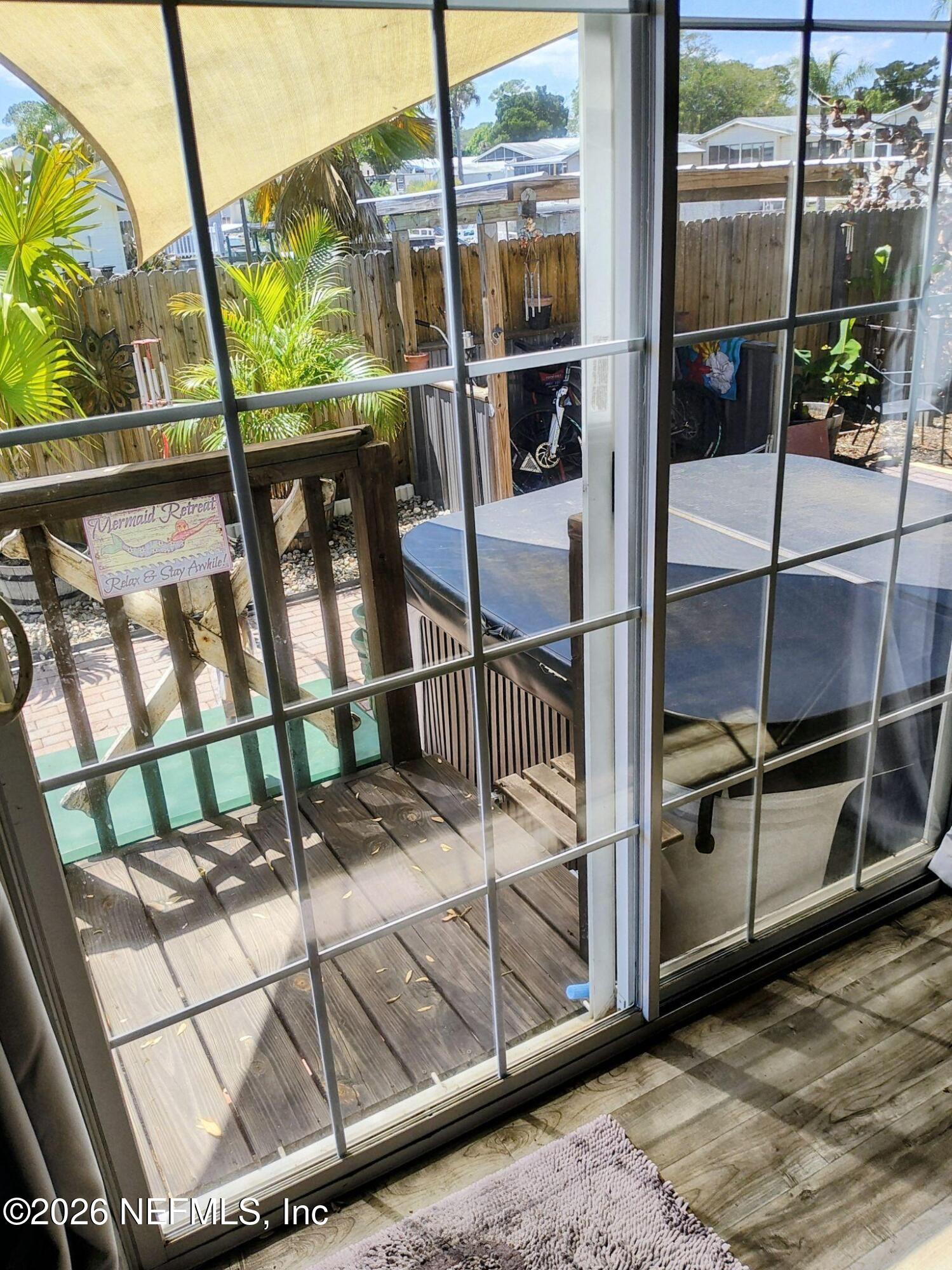 137 Lewis Street Edgewater, FL 32141 - Photo 36 of 42 a view of a balcony with a door of the house
