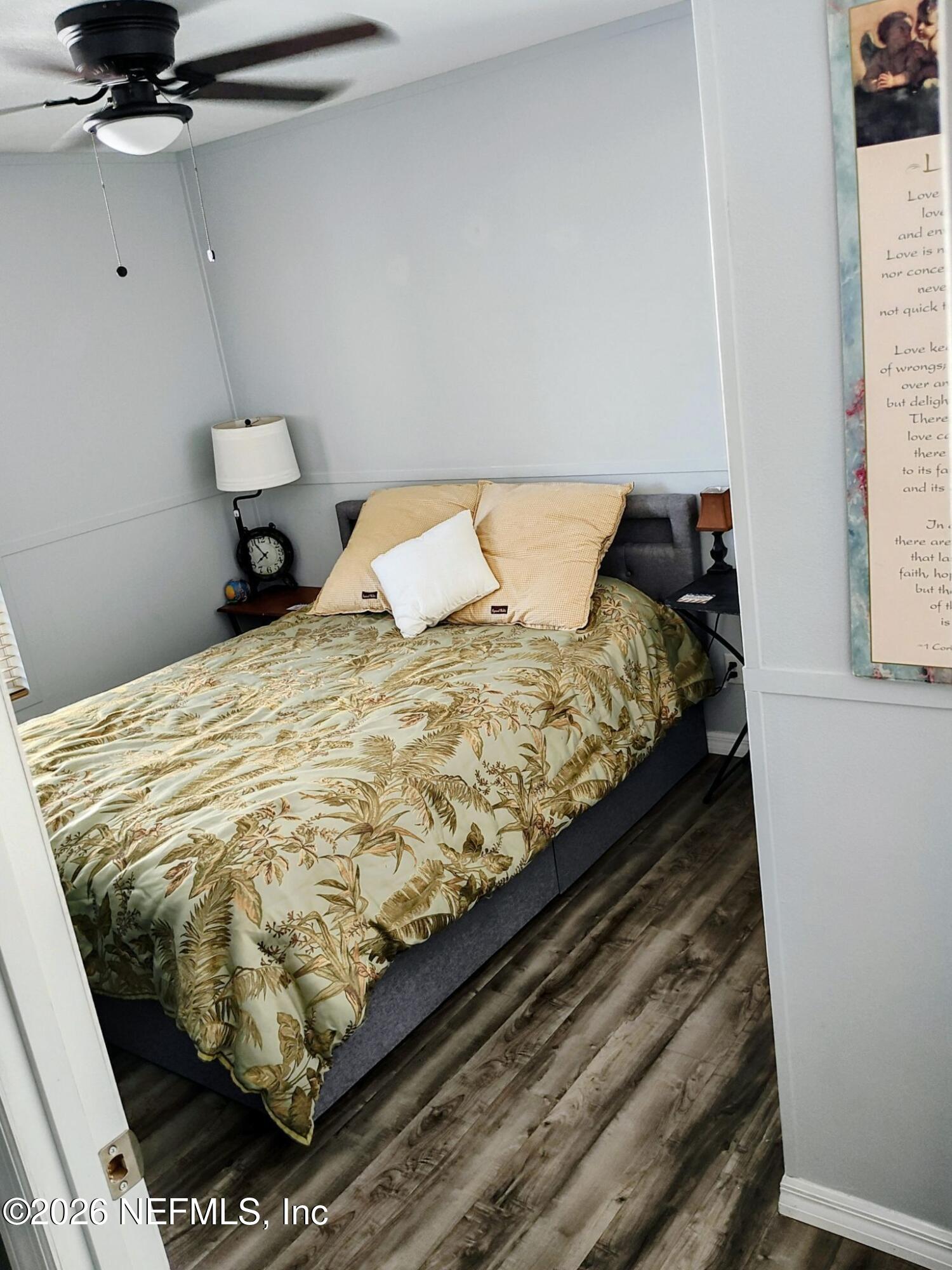 137 Lewis Street Edgewater, FL 32141 - Photo 39 of 42 a bed sitting in a bedroom next to a window