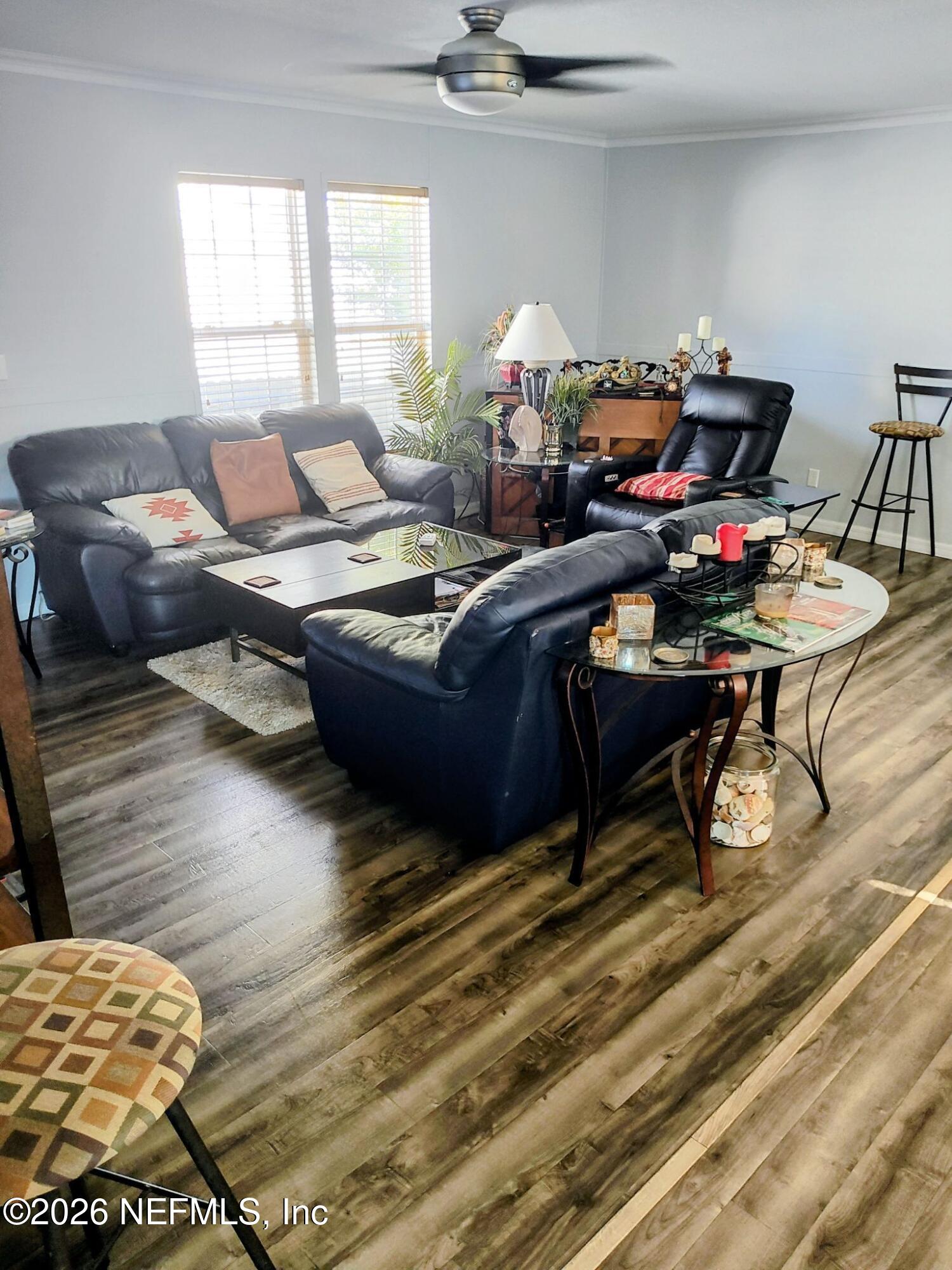 137 Lewis Street Edgewater, FL 32141 - Photo 7 of 42 a living room with furniture and a wooden floor