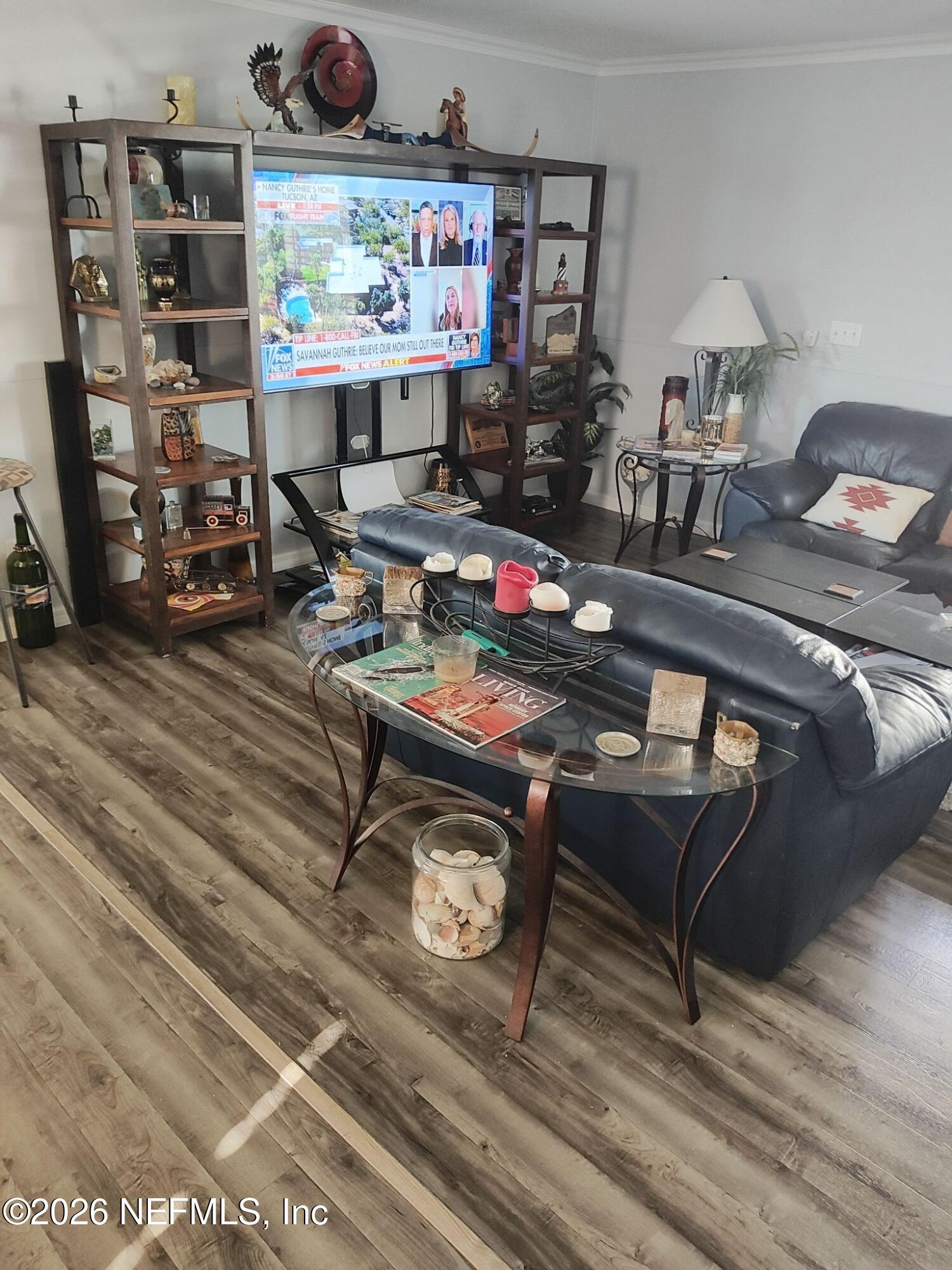 137 Lewis Street Edgewater, FL 32141 - Photo 8 of 42 a living room with furniture and a rug