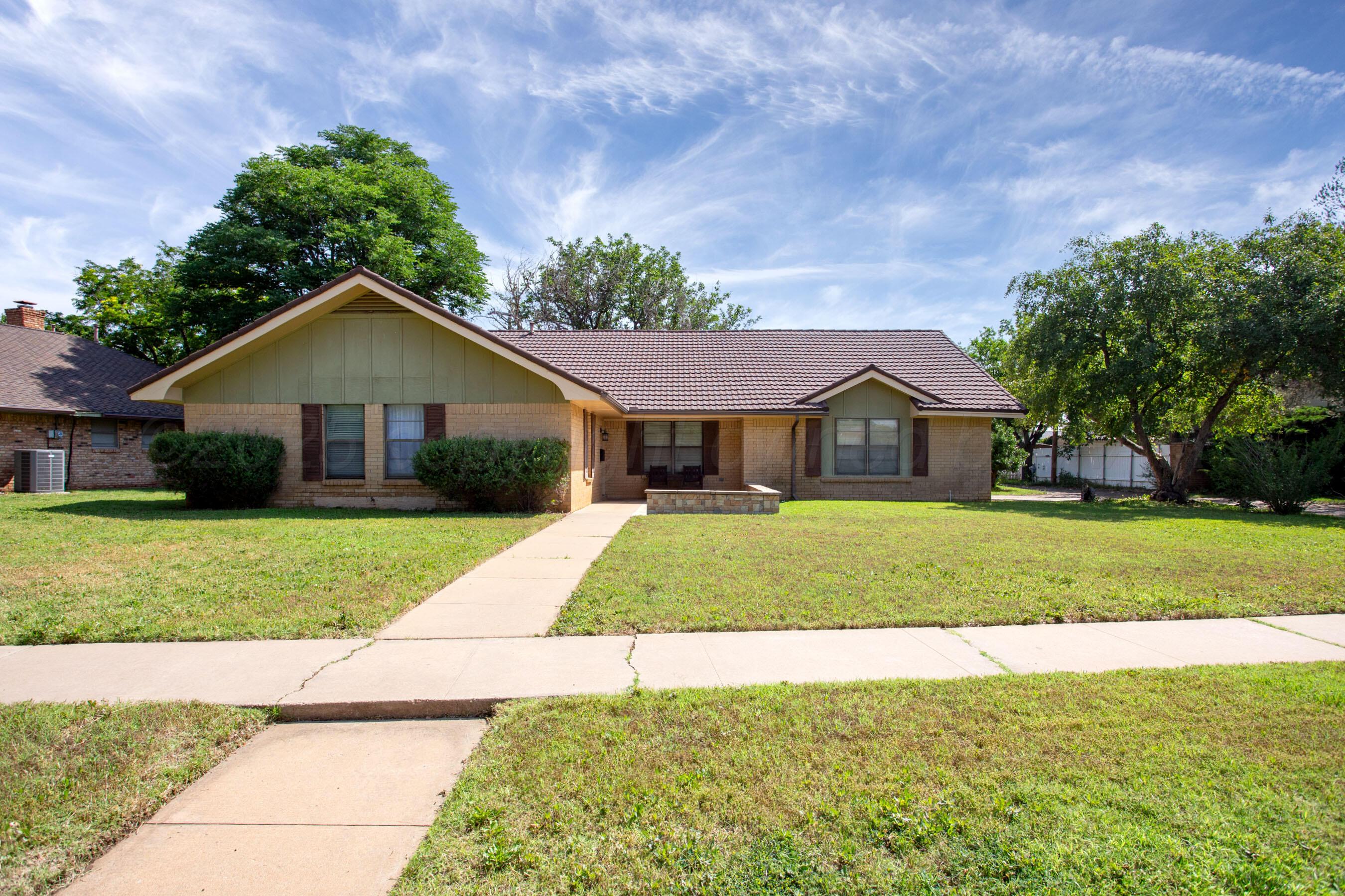 3729 Wayne Street Amarillo, TX 79109 - Photo 2 of 30 a front view of a house with a yard