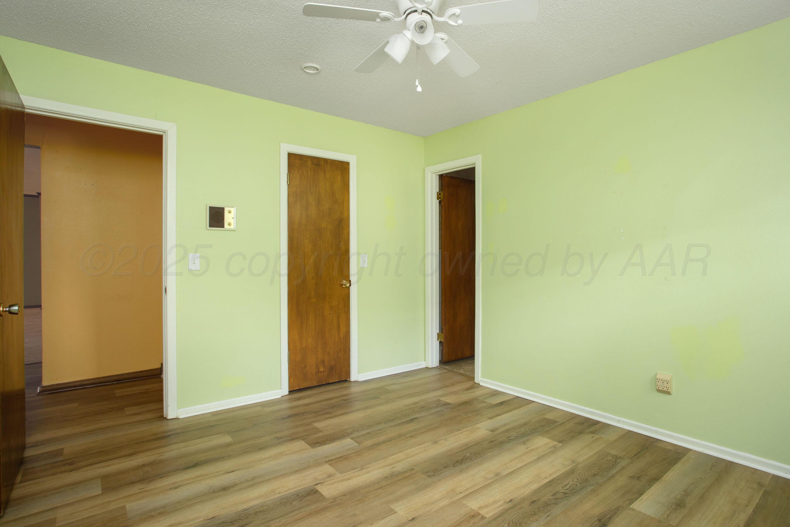 3729 Wayne Street Amarillo, TX 79109 - Photo 24 of 30 a view of an empty room with wooden floor