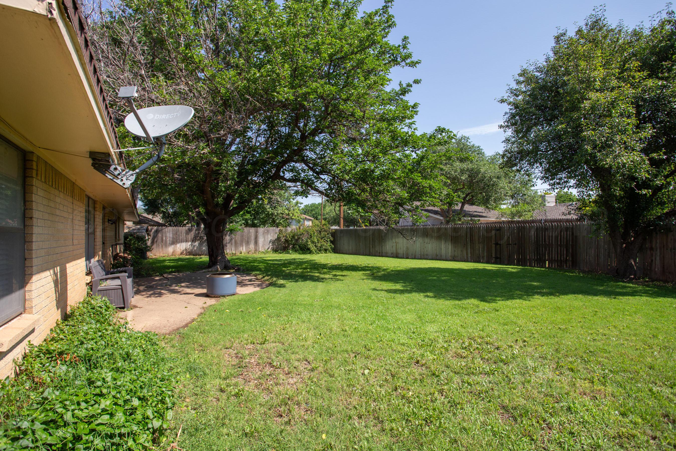 3729 Wayne Street Amarillo, TX 79109 - Photo 28 of 30 a view of a backyard with a tree