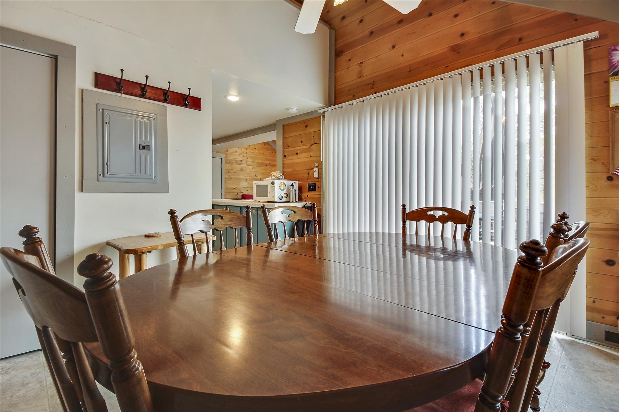 57397 Overlook Road Sunriver, OR 97707 - Photo 5 of 23 The charming dining area provides the perfect spot for family dinner and game nights.