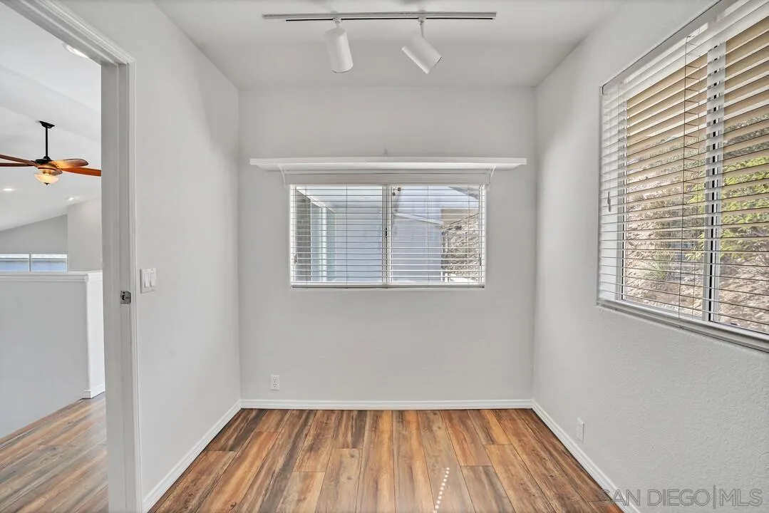 12040 Rocoso Road Lakeside, CA 92040 - Photo 22 of 56 a view of a room with wooden floor and windows