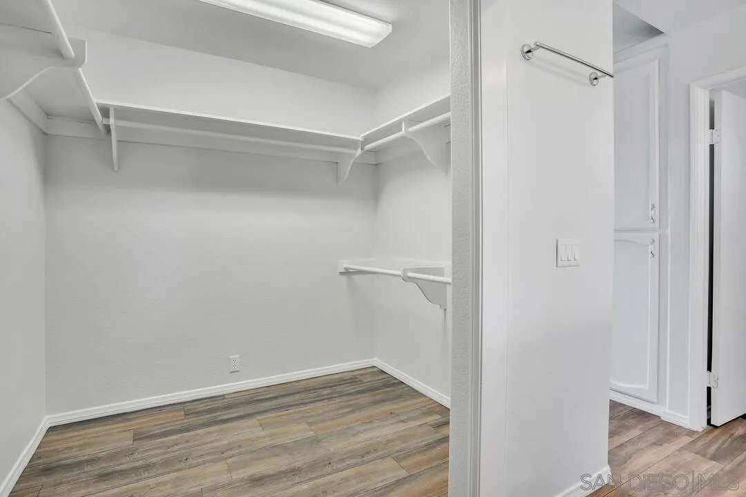 12040 Rocoso Road Lakeside, CA 92040 - Photo 30 of 56 a view of an empty walk in closet with empty racks