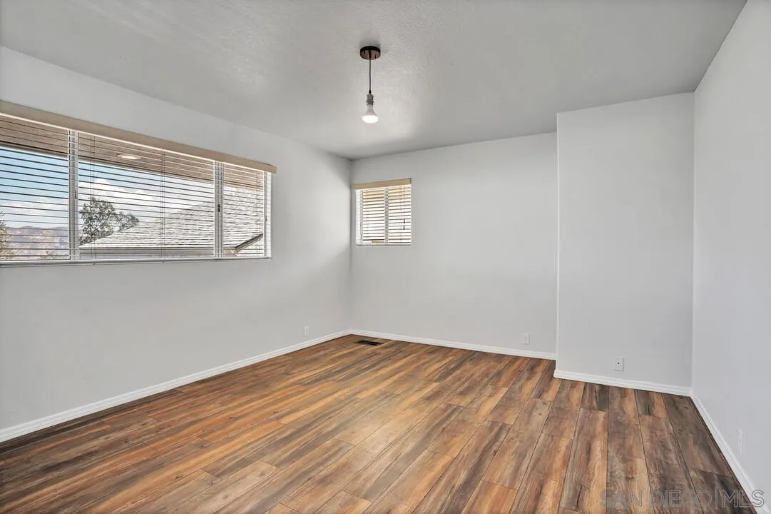 12040 Rocoso Road Lakeside, CA 92040 - Photo 31 of 56 a view of empty room with wooden floor and fan