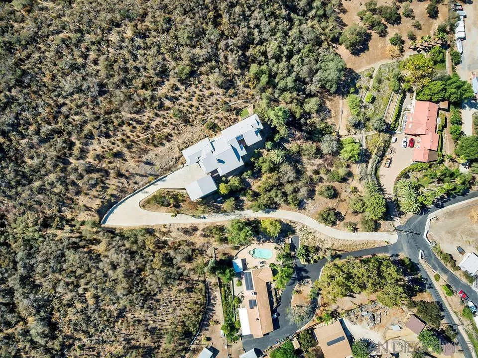 12040 Rocoso Road Lakeside, CA 92040 - Photo 50 of 56 an aerial view of a house with a yard and large trees