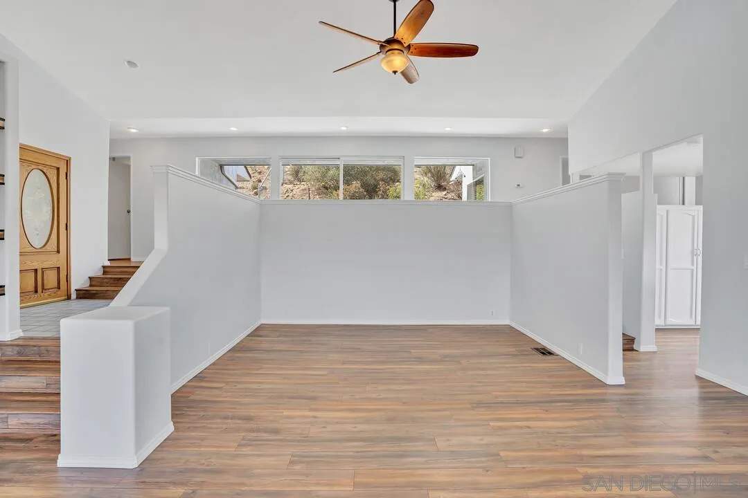 12040 Rocoso Road Lakeside, CA 92040 - Photo 8 of 56 wooden floor in an empty room with a window