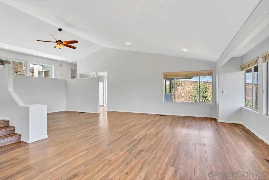 12040 Rocoso Road Lakeside, CA 92040 - Photo 10 of 56 a view of empty room with wooden floor and fan