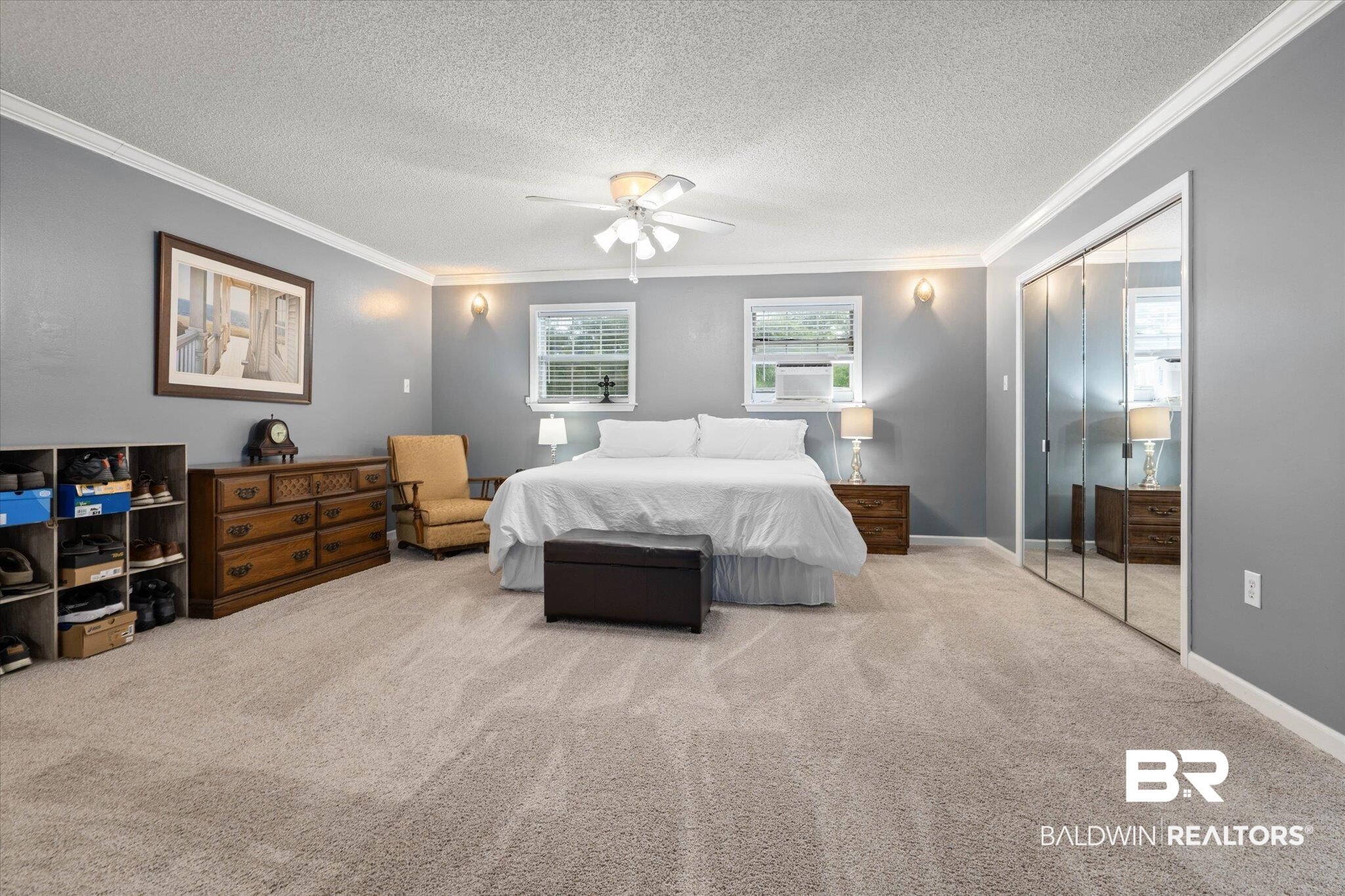 2300 Radcliff Road Saraland, AL 36571 - Photo 21 of 56 Bedroom featuring crown molding, carpet floors, a textured ceiling, a closet, and ceiling fan