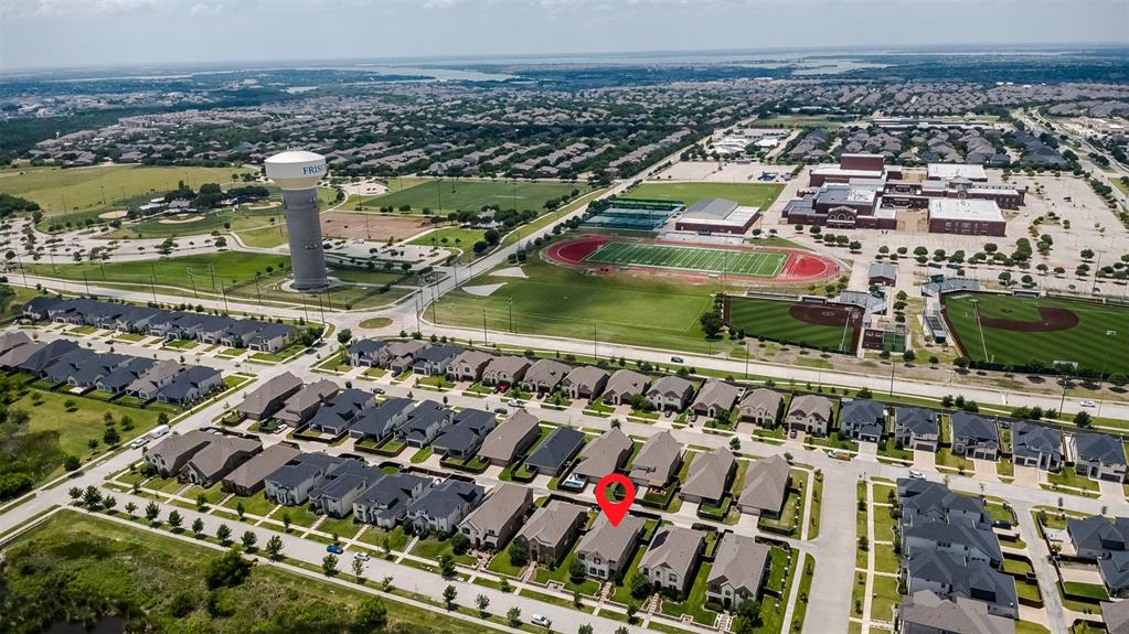 6333 Hall Road Frisco, TX 75034 - Photo 37 of 38 Aerial perspective showcasing a residential neighborhood with single-family homes and structured streets
