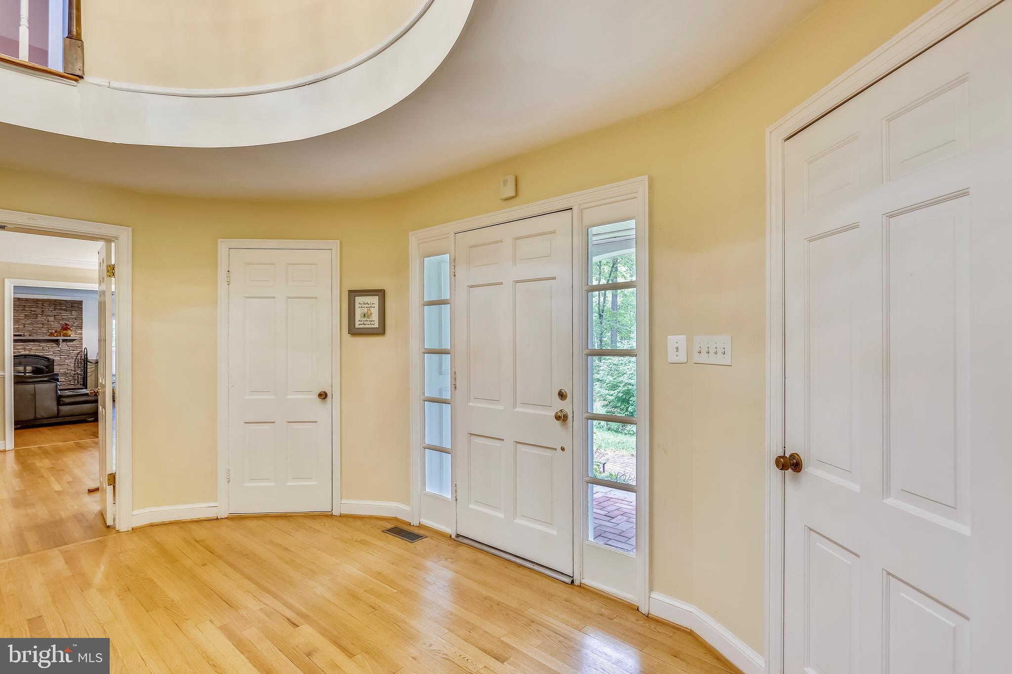 9420 Brink Road Laytonsville, MD 20882 - Photo 6 of 97 Oval foyer leads to conversation room to the right
