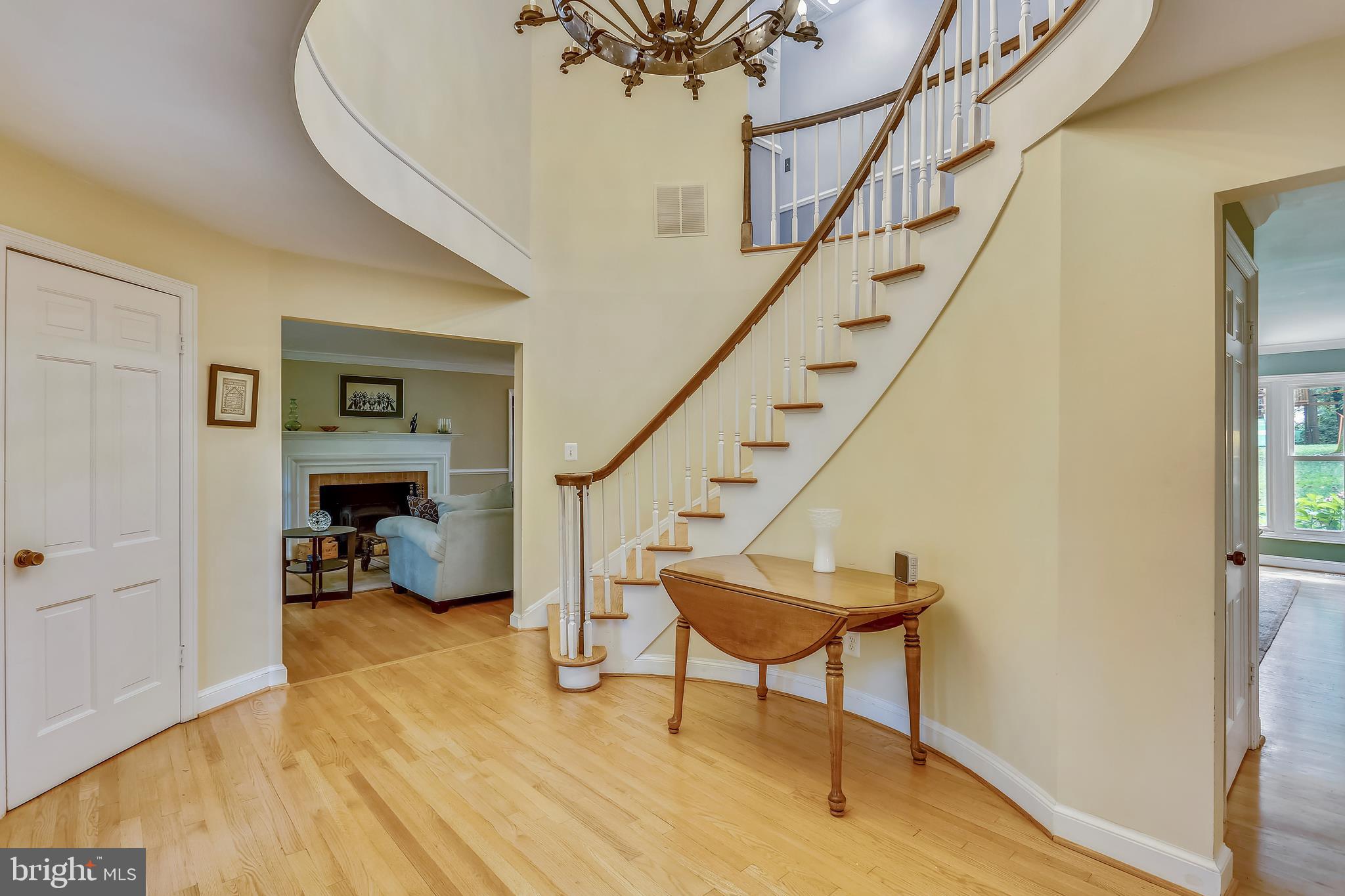 9420 Brink Road Laytonsville, MD 20882 - Photo 7 of 97 Oval foyer has curved stairs to bedroom level