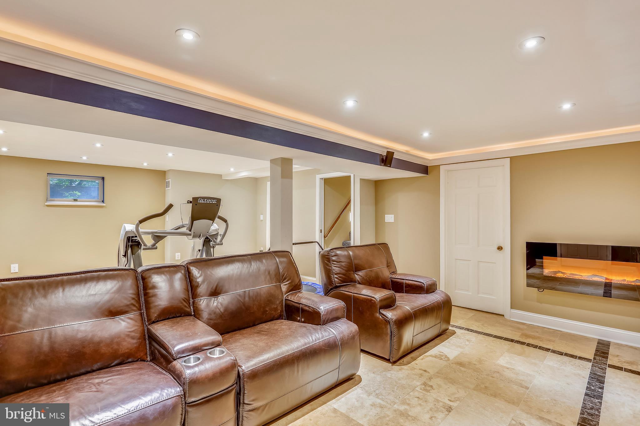 9420 Brink Road Laytonsville, MD 20882 - Photo 76 of 97 Media room with electric fireplace