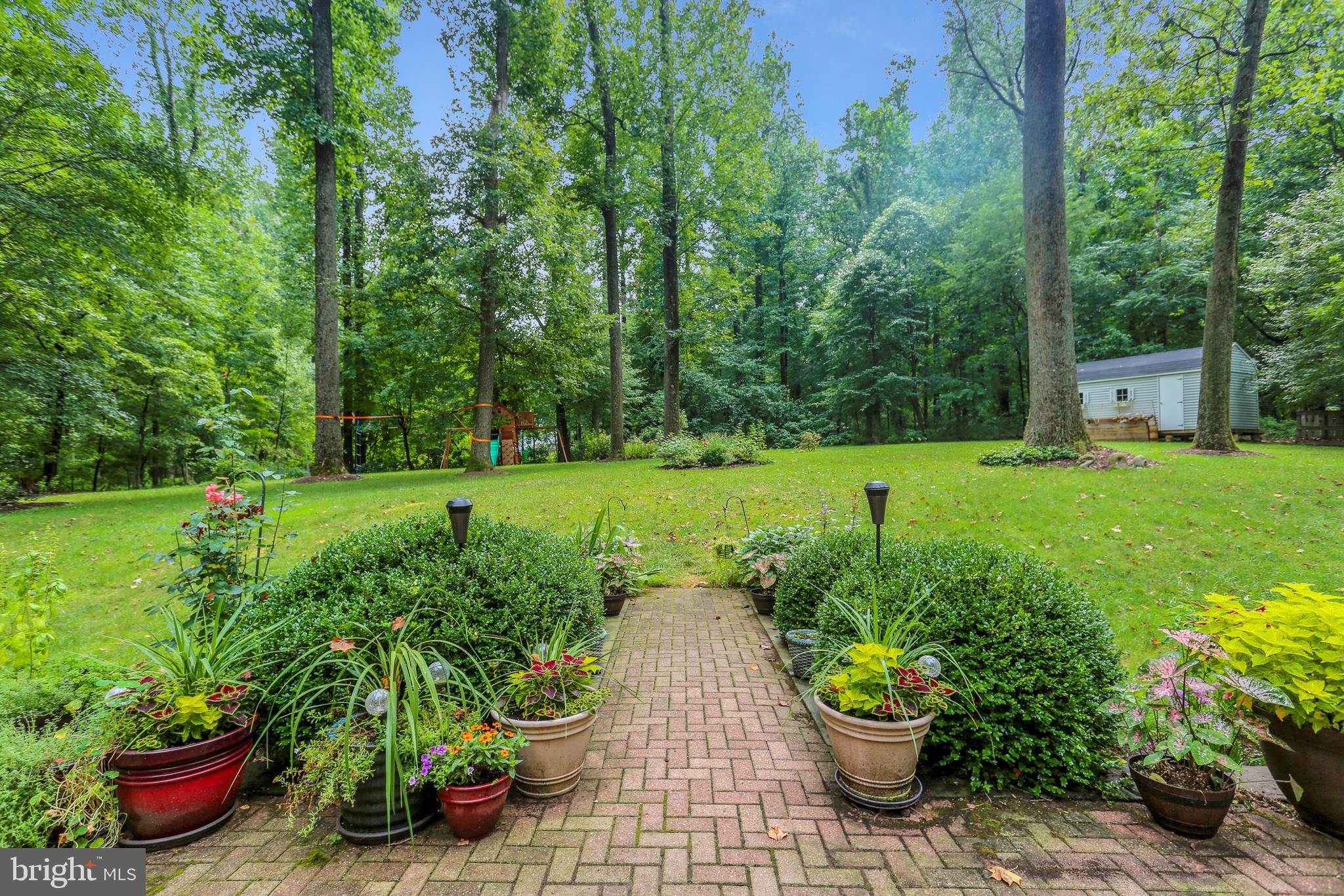 9420 Brink Road Laytonsville, MD 20882 - Photo 89 of 97 Walkway from the brick patio leads to the backyard