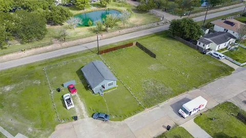 a view of swimming pool with outdoor seating and plants