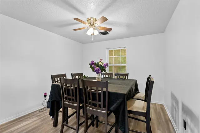 a bedroom with furniture and a flat screen tv