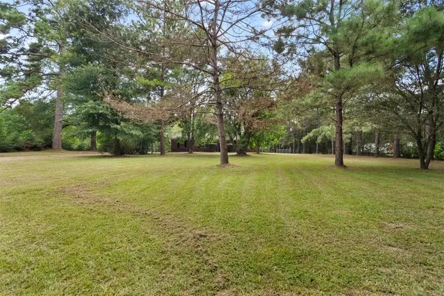 a view of outdoor space with deck and yard