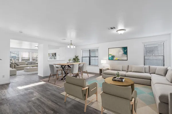 a living room with furniture and a table