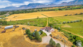 19 East Southfield Road Spanish Fork, UT 84660 - Photo 52 of 74 Aerial view of sparsely populated area with a mountainous background
