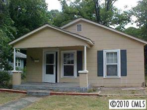 3916 Plainview Road Charlotte, NC 28208 - Photo 1 of 8 a front view of a house with garden
