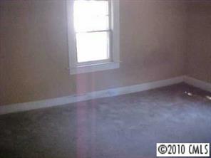3916 Plainview Road Charlotte, NC 28208 - Photo 3 of 8 an empty room with a window