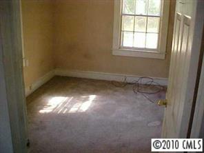 3916 Plainview Road Charlotte, NC 28208 - Photo 6 of 8 an empty room with a window