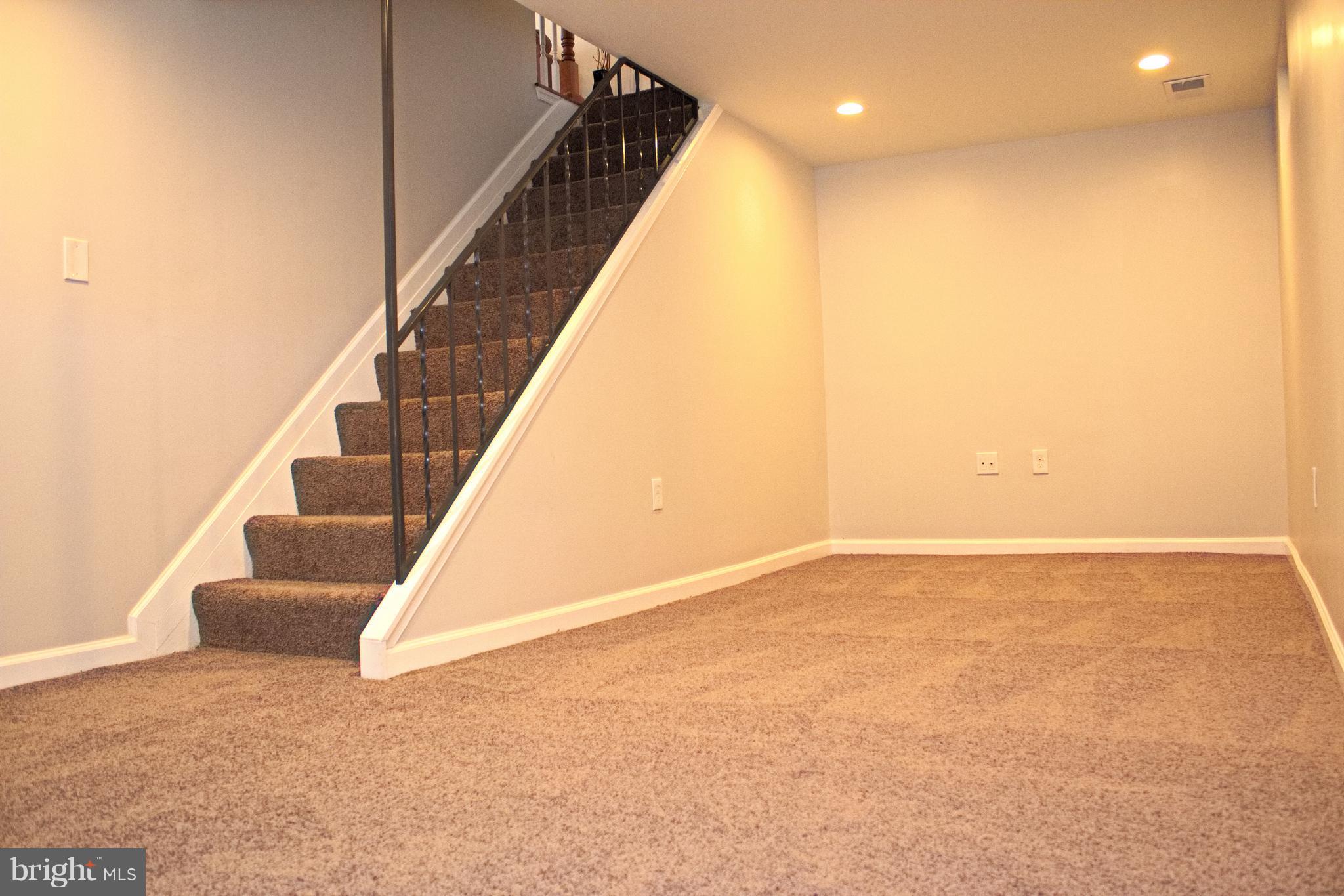 315 Highfalcon Road Reisterstown, MD 21136 - Photo 23 of 30 a view of an empty room with stairs