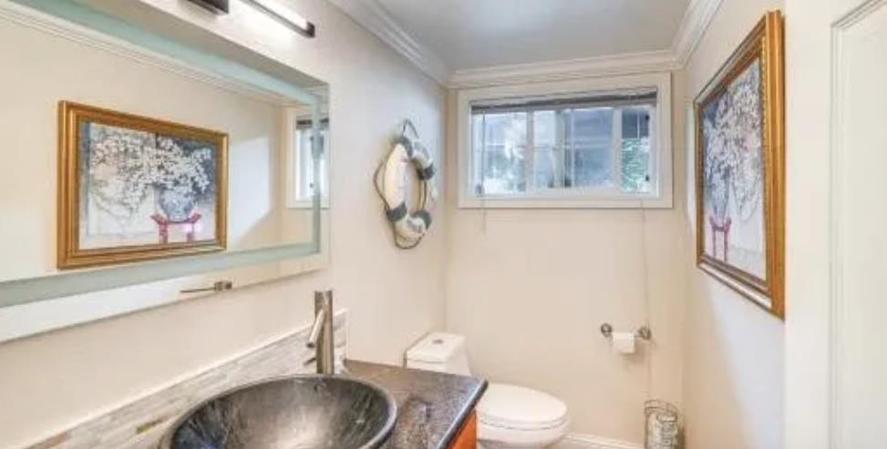 119 San Jose Street Salinas, CA 93901 - Photo 14 of 15 a bathroom with a sink and a mirror