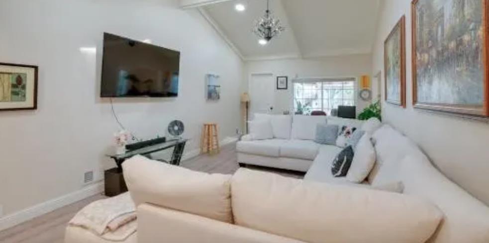 119 San Jose Street Salinas, CA 93901 - Photo 3 of 15 a living room with furniture and a flat screen tv