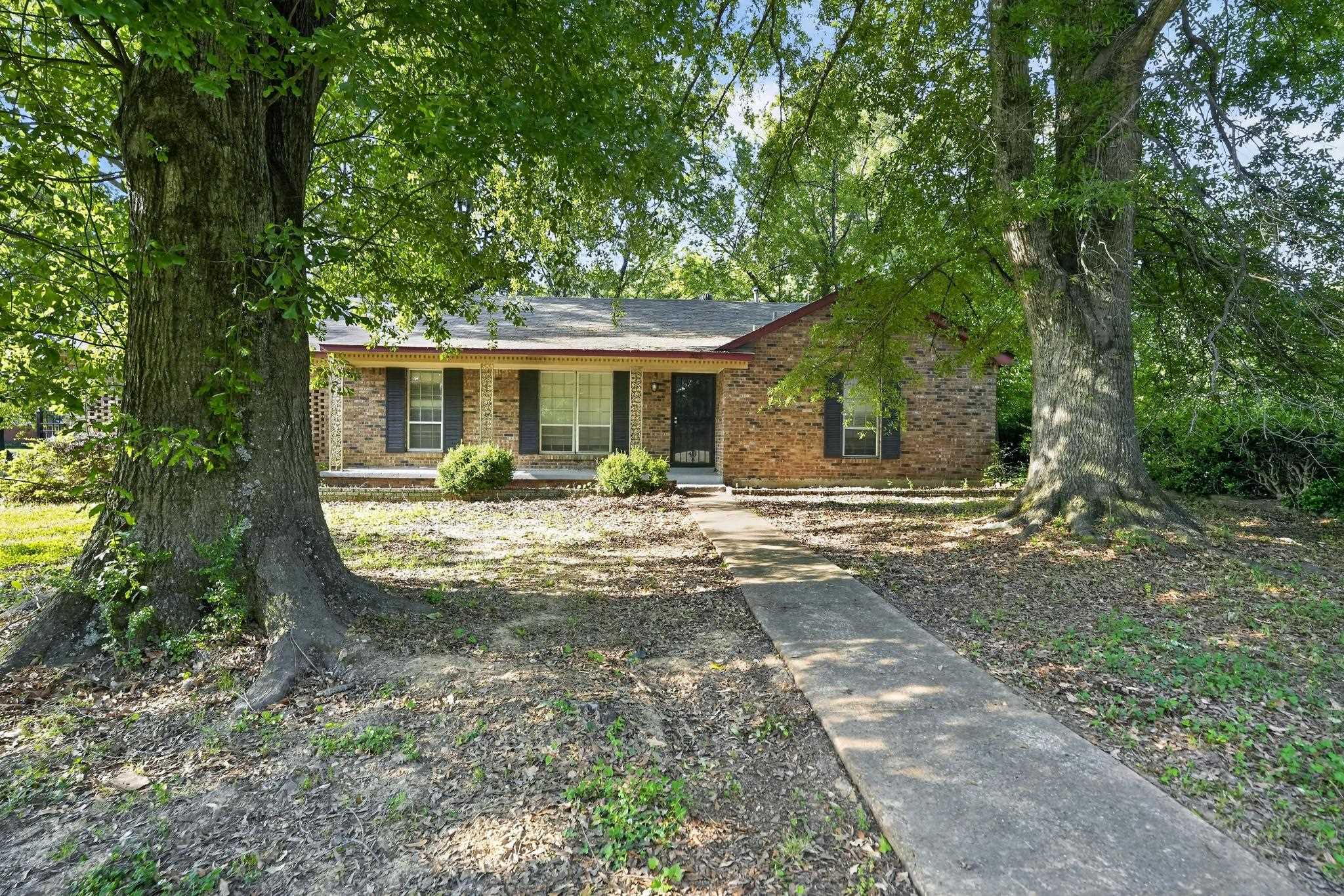 2015 East Holmes Road Memphis, TN 38116 - Photo 1 of 34 a view of a house with backyard and sitting area
