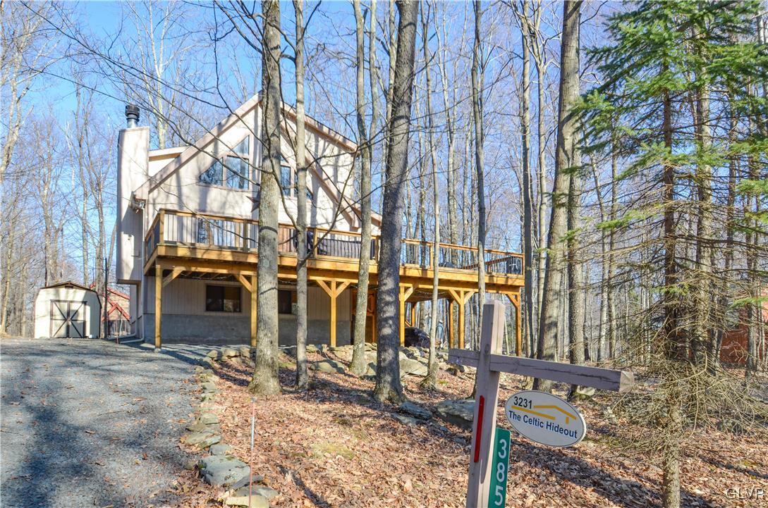 3231 Northgate Road Lake Ariel, PA 18436 - Photo 29 of 29 a view of a house with large trees