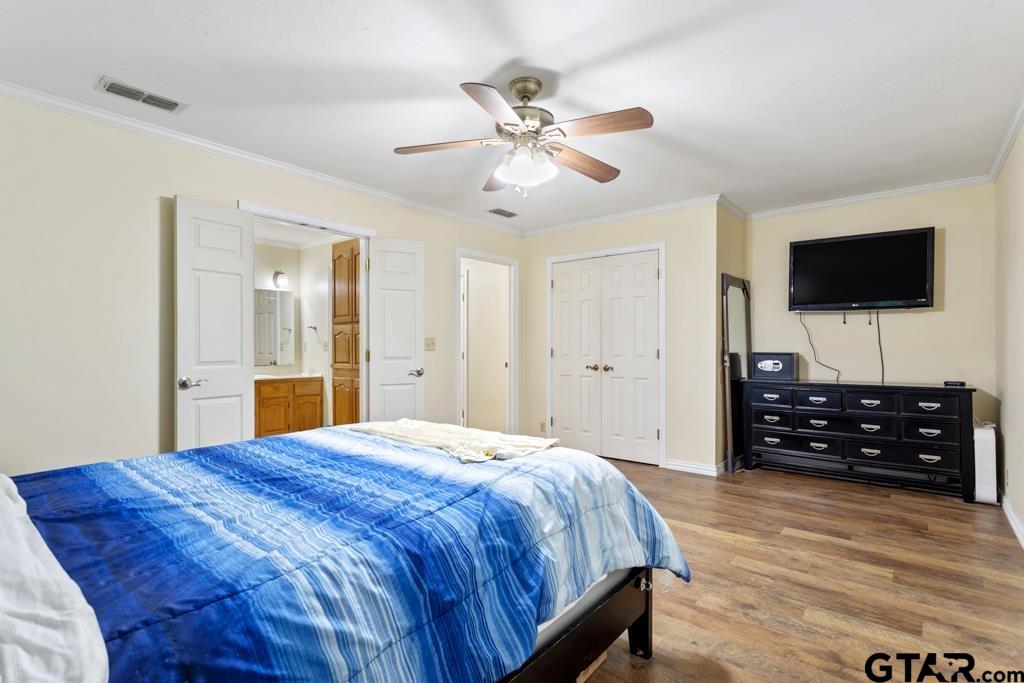448 North Hill Road Tyler, TX 75706 - Photo 16 of 30 a bedroom with a bed and a flat screen tv