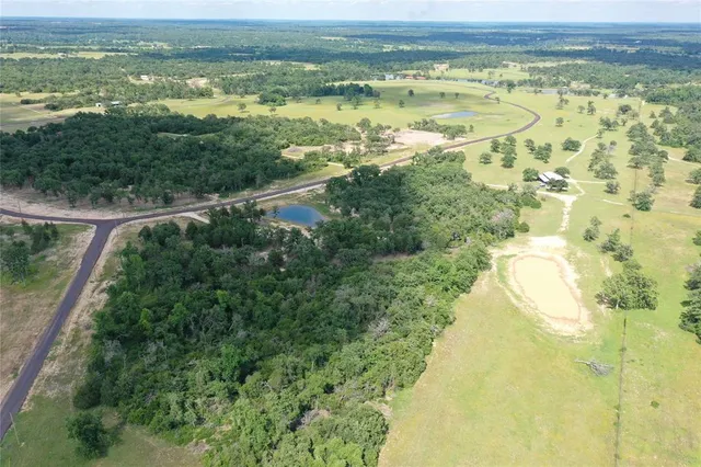 a view of a swimming pool and a yard
